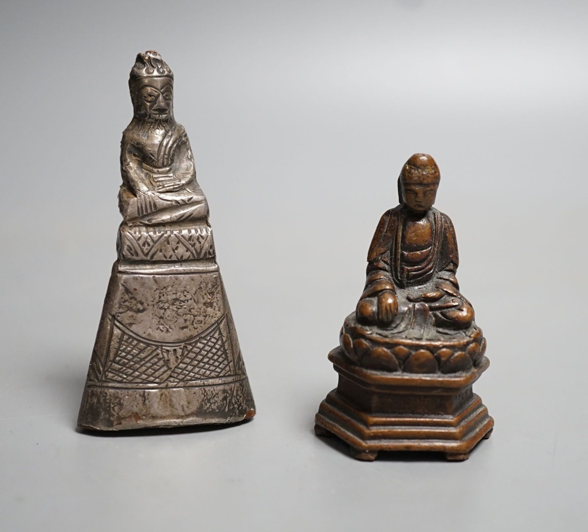 A small 19th century bronze figure of Buddha seated and a Burmese silver overlaid wood figure of Buddha, largest 7.5cm